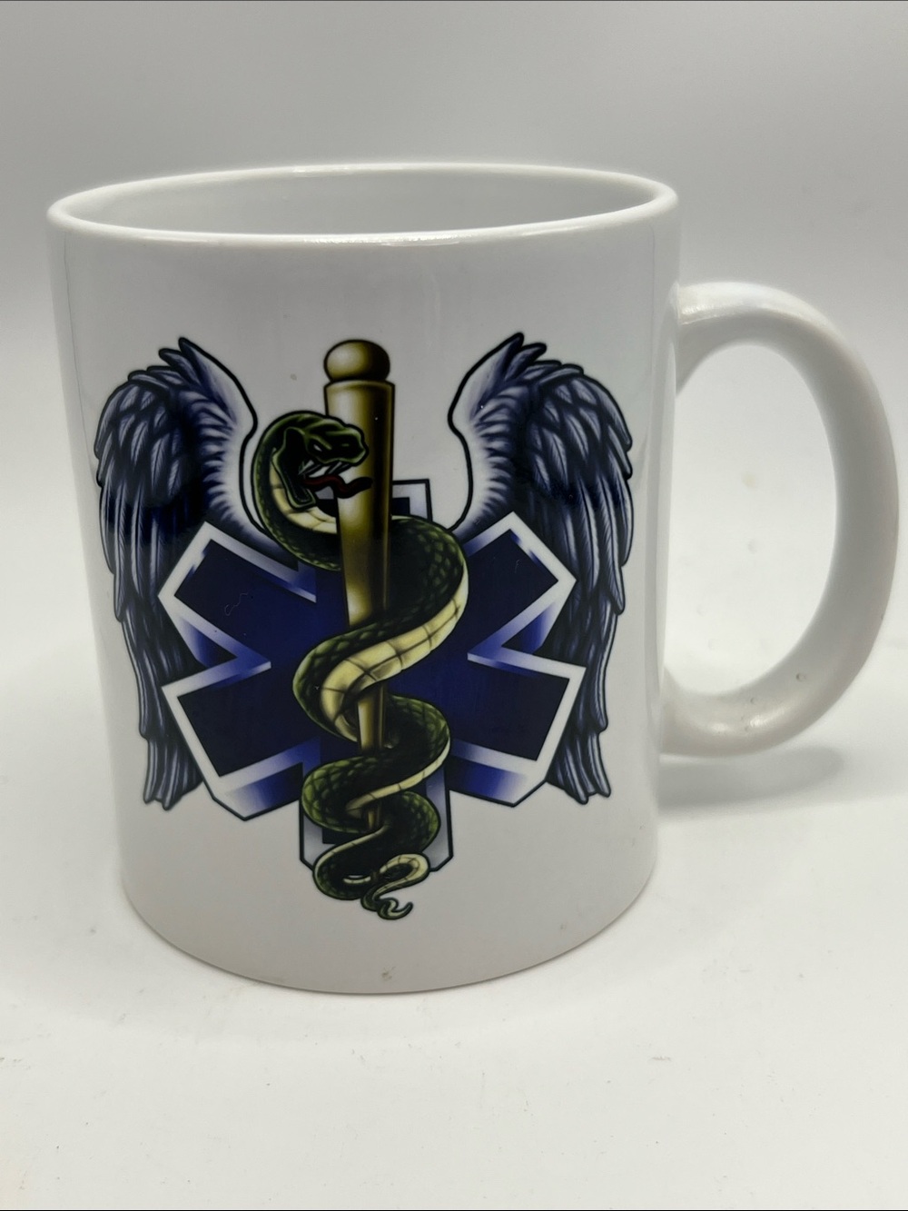 White Ceramic Medical Caduceus Mug - Blue and White Emblem. Green and Yellow Snk